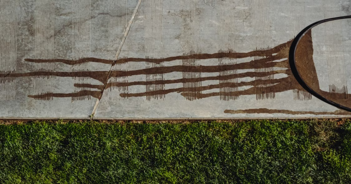 Water Leak Under a Concrete Slab_ How Non-Invasive Leak Detection Works Plumber using equipment to detect a water leak under concrete